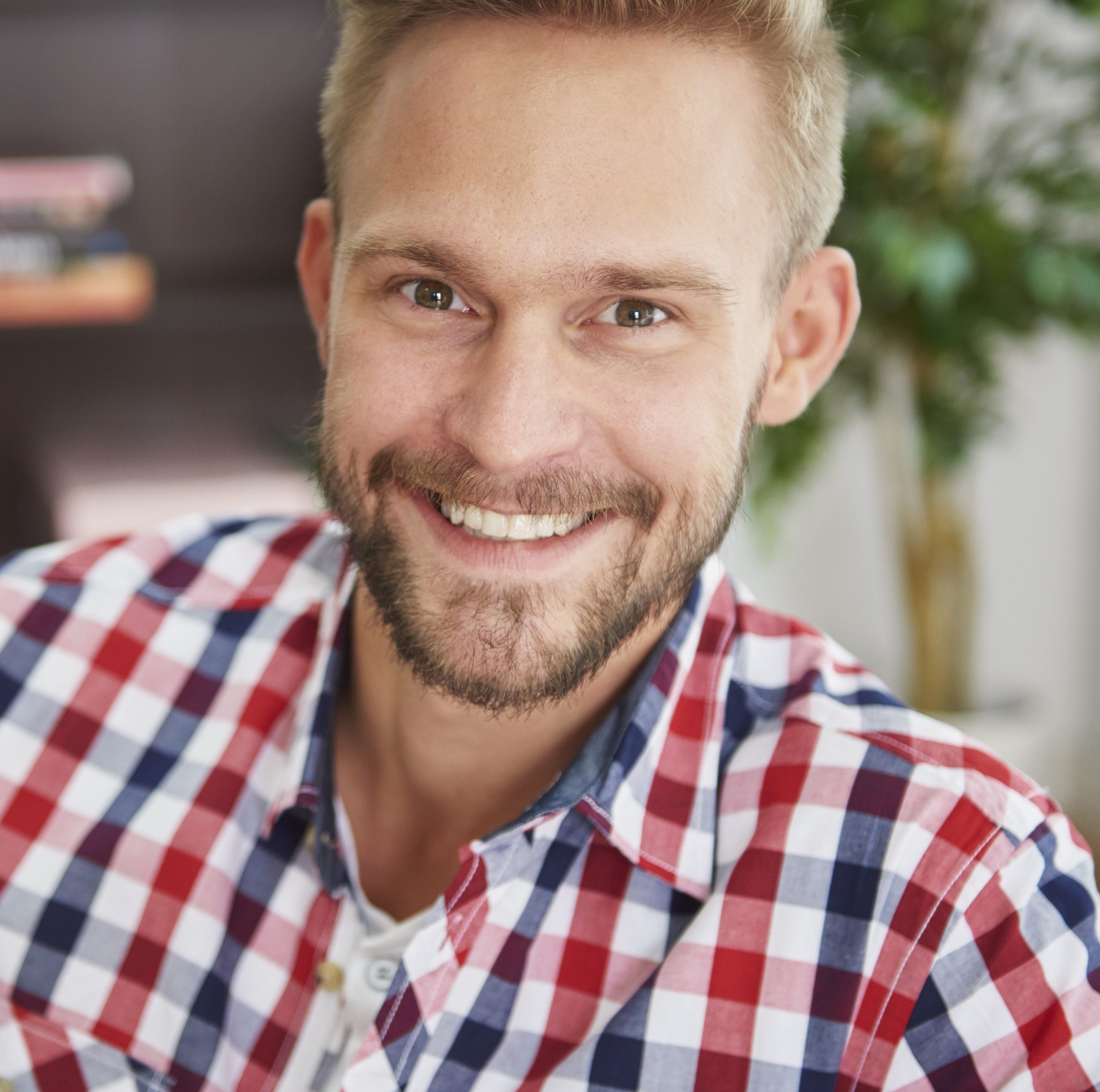 portrait handsome man living room scaled